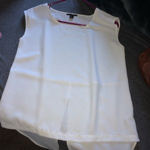 White tank top with a high low style back.